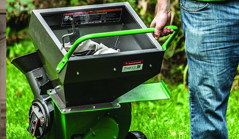 Man Uses Green Leaf Mulcher