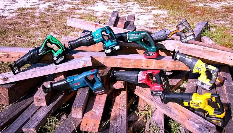 Reciprocating saws lay on wooden blocks
