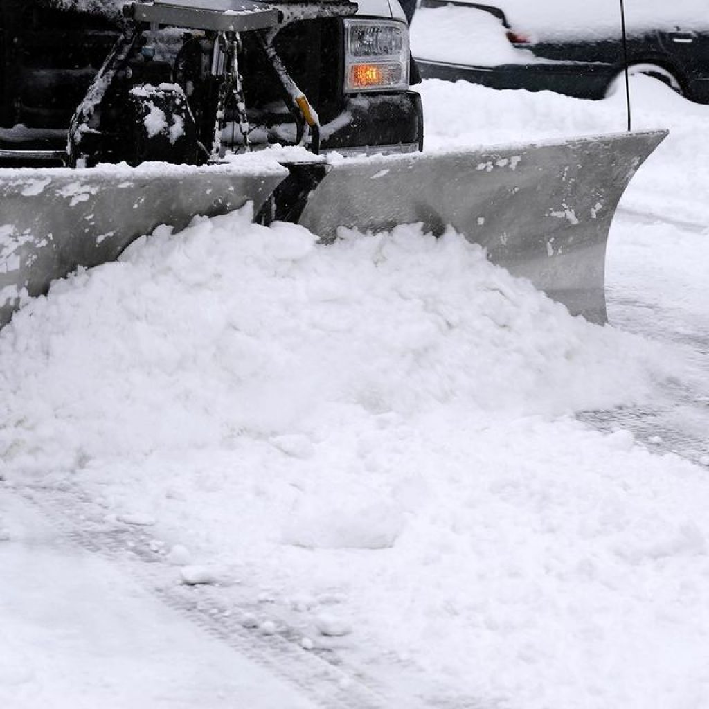 Snow Thrower removes snow