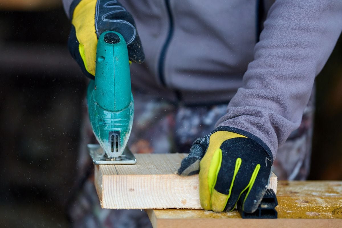 woodworker uses jigsaw