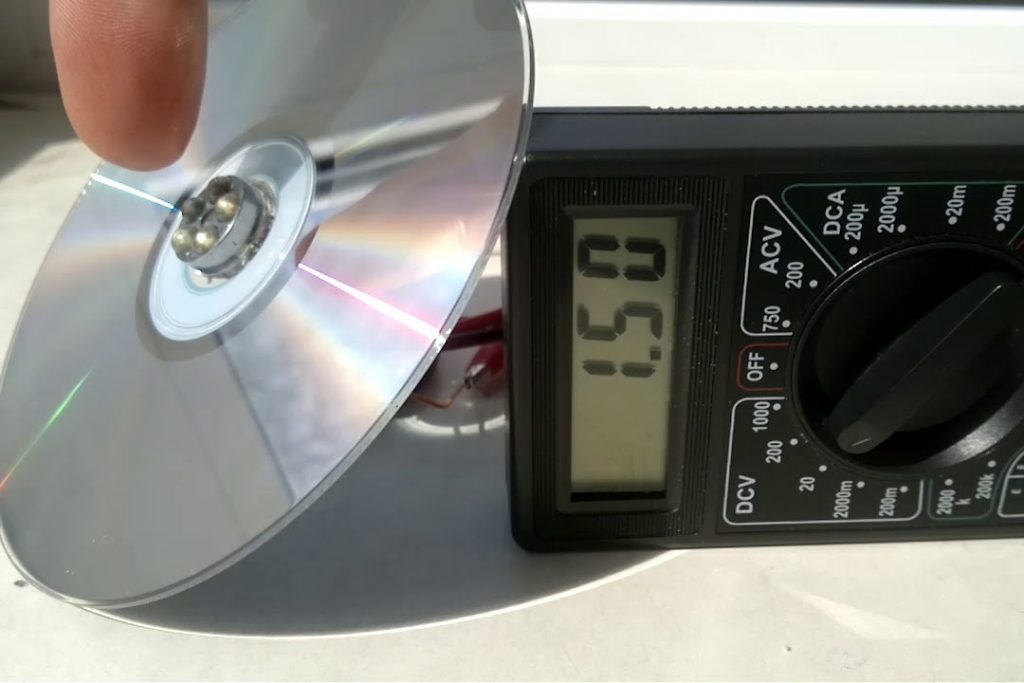 The CD lies on the multimeter