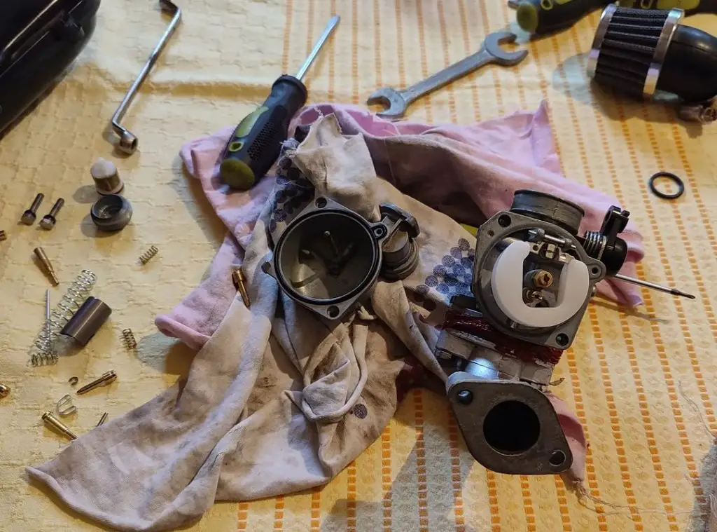 carburetor disassembled for cleaning