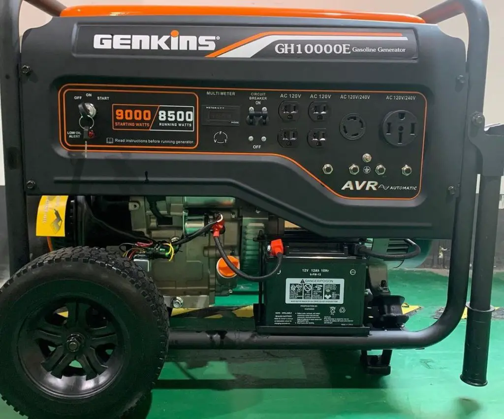 portable black generator on a green background