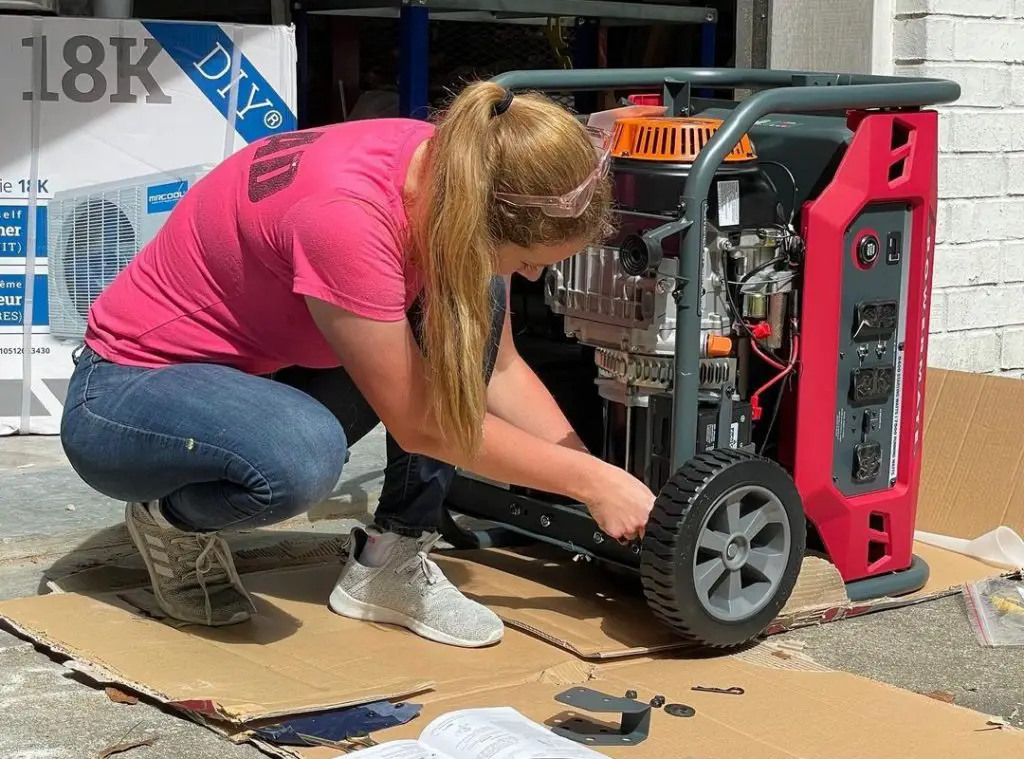 a woman dismantling a generator in front of a garage