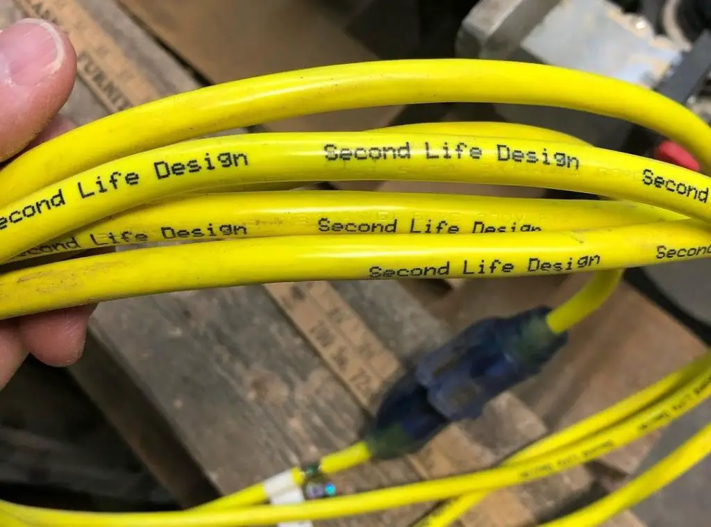 yellow cable in hand