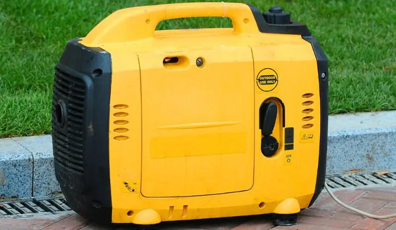 Generator near the field of grass