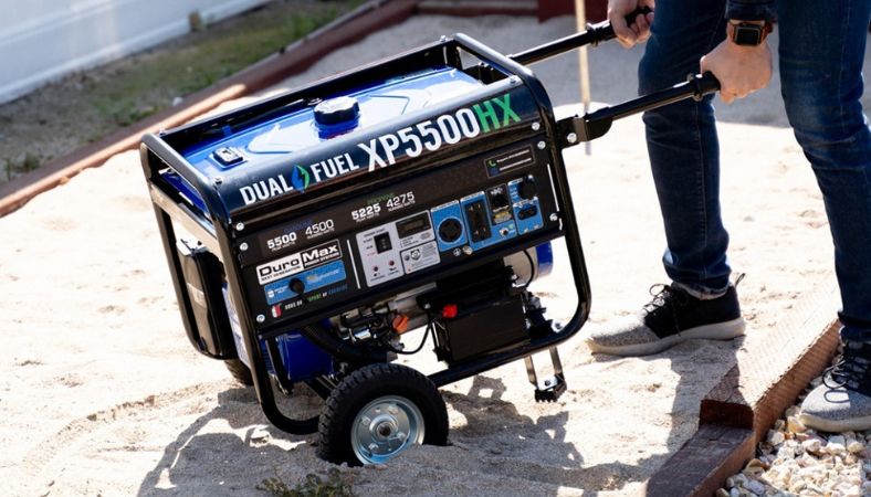 Man with the generator on the sand