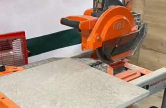 Orange tile saw cutting a tile